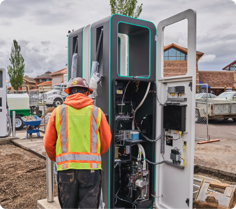 Engineer working on charging station.